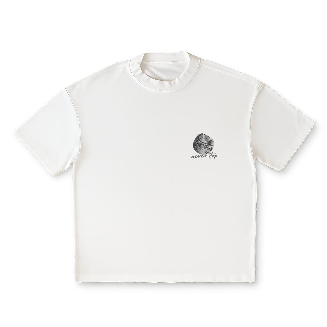 White t-shirt with a small graphic and text on a clear background